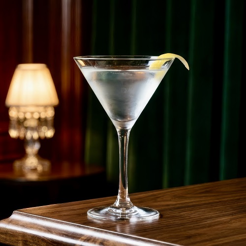 Vesper Martini cocktail in a martini glass,garnished with lemon.